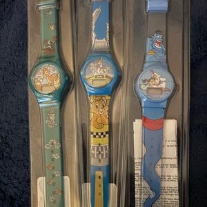 Listing for daynuh721 Disney watches - Oliver, Aladdin, and Bambi
